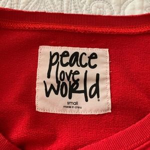 Peace Love World Cropped Sweatshirt